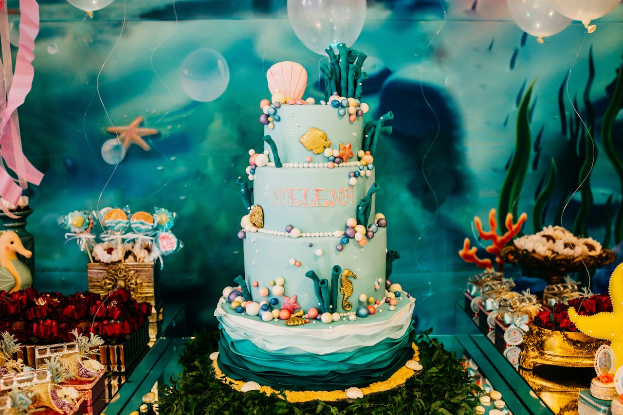 A beautiful underwater themed birthday cake with ocean decorations, perfect for a celebration.