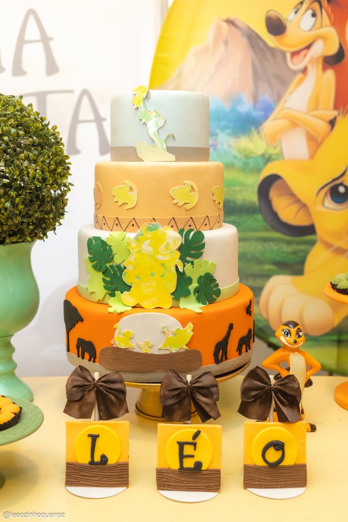 A vibrant Lion King themed birthday cake and decoration set perfect for childrens parties.